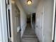 Inviting entryway with gray wood flooring, neutral walls, and trimwork, leading to other rooms in the home at 84 Commons Cir, Clayton, NC 27520
