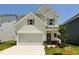 Two story home featuring a two car garage, craftsman style accents, manicured lawn, and new construction at 84 Commons Cir, Clayton, NC 27520