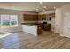 Open-concept kitchen boasts ample cabinetry and granite countertops with modern finishes at 84 Commons Cir, Clayton, NC 27520