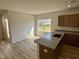 Kitchen with granite countertops and a stainless sink overlooking the backyard at 84 Commons Cir, Clayton, NC 27520