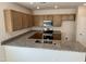 Kitchen features granite countertops, stainless steel appliances, and a breakfast bar at 84 Commons Cir, Clayton, NC 27520