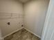 Convenient laundry room with tiled flooring, and washer/dryer hookups at 84 Commons Cir, Clayton, NC 27520