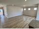 Spacious living room with wood-look flooring and plenty of natural light at 84 Commons Cir, Clayton, NC 27520