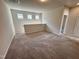 Cozy loft area with soft carpeting and natural light from the windows at 84 Commons Cir, Clayton, NC 27520