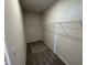 Walk-in closet with carpet and wire shelving at 84 Commons Cir, Clayton, NC 27520