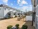 Expansive view of townhome backyards with patios and lawns, creating a sense of community and outdoor space at 8410 Zinc Autumn Path, Raleigh, NC 27615