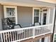 Relaxing balcony featuring outdoor seating and a charming neighborhood view from two large windows at 8410 Zinc Autumn Path, Raleigh, NC 27615