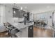 Modern kitchen featuring granite countertops, stainless steel appliances, and a breakfast bar at 8410 Zinc Autumn Path, Raleigh, NC 27615