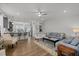 Spacious living room featuring hardwood floors, neutral decor, and an open layout to the kitchen at 8410 Zinc Autumn Path, Raleigh, NC 27615