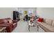 Versatile living space with desk area, comfortable seating, natural light from two windows, and modern decor at 8410 Zinc Autumn Path, Raleigh, NC 27615