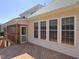View of the home's rear deck, enclosed porch, and large windows at 8417 Henderson Rd, Apex, NC 27539