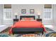 Stylish bedroom with a colorful rug and side tables with lamps at 8417 Henderson Rd, Apex, NC 27539
