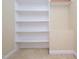 Well-organized closet space with built-in shelving and a hanging rod at 8417 Henderson Rd, Apex, NC 27539