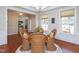 Bright dining room with large windows and hardwood floors at 8417 Henderson Rd, Apex, NC 27539