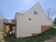 Side exterior view of home with a deck, siding and a walkout basement at 8417 Henderson Rd, Apex, NC 27539