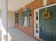 Charming entryway with green door and decorative wreath at 8417 Henderson Rd, Apex, NC 27539