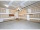 View of a two car garage with unfinished walls and electric openers at 8417 Henderson Rd, Apex, NC 27539