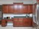 Kitchen with ample cabinet space, granite counters, and stainless steel fridge, designed for functionality at 8417 Henderson Rd, Apex, NC 27539