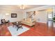 Living room with hardwood floors and neutral décor, offers a warm, inviting and bright space at 8417 Henderson Rd, Apex, NC 27539
