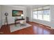 Bright home office with large window and hardwood floors at 8417 Henderson Rd, Apex, NC 27539