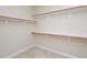 Spacious walk-in closet featuring ample shelving space to maximize your wardrobe storage at 8417 Henderson Rd, Apex, NC 27539