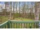 A deck overlooks the wooded backyard, offering a tranquil outdoor living space at 900 Cricket Knoll Rd, Fuquay Varina, NC 27526