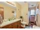 Bathroom has a classic vanity, toilet, and walk-in shower at 900 Cricket Knoll Rd, Fuquay Varina, NC 27526