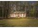 Charming single-story home with a well-manicured lawn and mature trees creating a serene setting at 900 Cricket Knoll Rd, Fuquay Varina, NC 27526