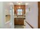 Charming kitchen area featuring classic cabinetry, a window above the sink, and bright lighting at 900 Cricket Knoll Rd, Fuquay Varina, NC 27526