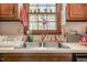 A double stainless steel sink sits beneath a window in this functional kitchen space at 900 Cricket Knoll Rd, Fuquay Varina, NC 27526