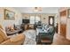 Bright living room with a ceiling fan, a large window, and comfortable seating at 900 Cricket Knoll Rd, Fuquay Varina, NC 27526
