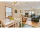 Open-concept living room with a view into the dining area, perfect for entertaining at 900 Cricket Knoll Rd, Fuquay Varina, NC 27526