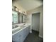 Bathroom with double vanity, attractive lighting, and tile floor at , Durham, NC 27712