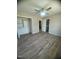 Neutral bedroom featuring wood-look floors, ceiling fan and an ensuite bathroom at , Durham, NC 27712