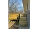 Close-up of the new wooden deck featuring a black railing and steps leading to the yard at , Durham, NC 27712