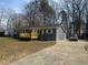 A charming gray house with a new wooden front deck and long concrete driveway is ready for new owners at , Durham, NC 27712