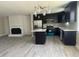 Stylish kitchen with dark cabinetry, stainless steel appliances, and a center island ideal for cooking and dining at , Durham, NC 27712