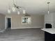 Bright, open-concept living room with modern lighting and a fireplace that offers comfort and style at , Durham, NC 27712
