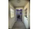 Hallway between two entry doors reveals utility closet with water heater and electrical panel at , Durham, NC 27712