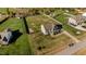 Aerial view of home with a large, well-maintained lawn and privacy fencing at 1036 Butterfly Cir, Wake Forest, NC 27587