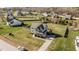 Aerial view of a gray two-story home with large lawn, surrounded by a wooden fence at 1036 Butterfly Cir, Wake Forest, NC 27587