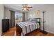 Bedroom with neutral decor, hardwood floors, and a ceiling fan at 1036 Butterfly Cir, Wake Forest, NC 27587