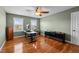 Bedroom with a ceiling fan, hardwood floors, and two windows at 1036 Butterfly Cir, Wake Forest, NC 27587