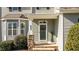 Inviting front entrance with decorative shrubbery and stone accents add beauty to this lovely home at 1036 Butterfly Cir, Wake Forest, NC 27587