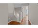 Hallway with hardwood floors leading to a bright room at 1036 Butterfly Cir, Wake Forest, NC 27587