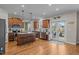 Well-lit kitchen features an island with barstool seating and stainless steel appliances with deck access at 1036 Butterfly Cir, Wake Forest, NC 27587