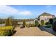 Brick patio features a small brick retaining wall, landscaping and seating at 1036 Butterfly Cir, Wake Forest, NC 27587