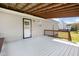 Large covered back deck with stairs to the lawn at 105 Seminole Dr, Wendell, NC 27591