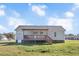 Back exterior of home with a covered deck and steps to the yard at 105 Seminole Dr, Wendell, NC 27591