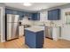 Beautiful kitchen boasts stainless steel appliances, subway tile backsplash, and a center island with granite countertop at 105 Seminole Dr, Wendell, NC 27591